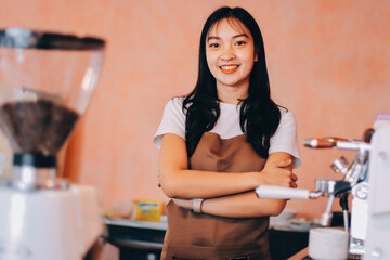 Fototapeta premium Young woman at barista school learning how to make espresso coffee.