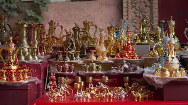 Ornate Middle Eastern Teapots and Souvenirs at Market Stall
