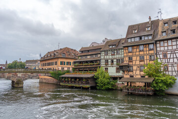Naklejka premium Traditional restaurant on the riverside in Petite France, Strasbourg