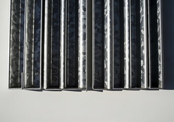 Obraz premium Top view of galvanized steel metal profiles with repetitive pattern