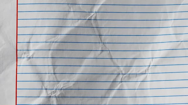 Closeup of Crumpled Lined Paper with Red Margin.