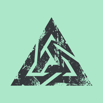 A dark distressed triangular geometric symbol on a light background