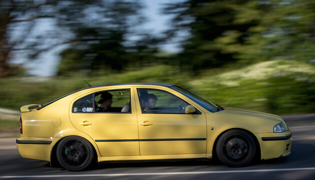Milton Keynes,Bucks,UK - May 25th 2026: 2002 yellow Skoda Octavia classic  car driving on a British road