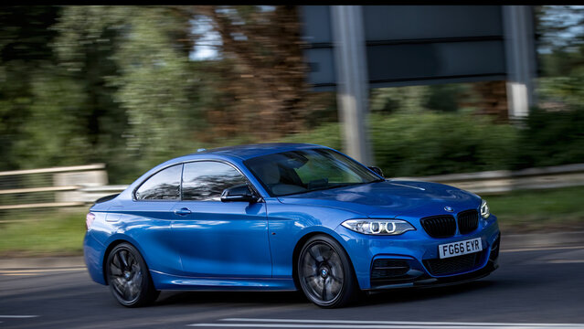 Milton Keynes,Bucks,UK - May 23rd 2026: 2016 blue BMW m 240i 2 series car driving on a British road