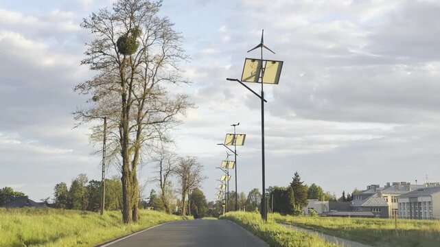 Wind and solar powered street lights under cloudy sky