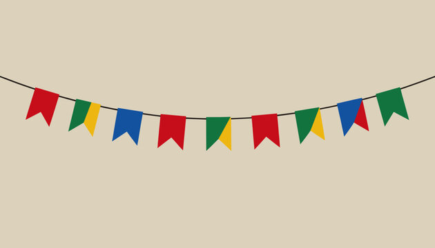 Colorful Party Flags Hanging Against Beige Background