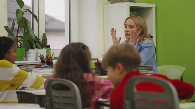 Teacher feeling tired while pupils play with paper planes during lesson