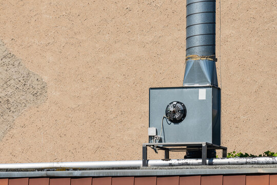 Ventilation system on the roof of a building in a sunny area