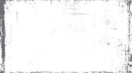 Fototapeta premium Distressed grunge texture with dark gray border and scattered speckles on white background