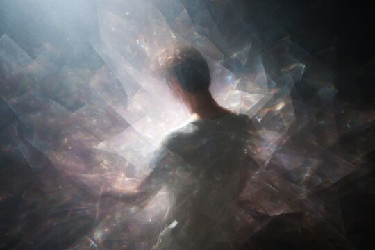 Integrator maximal person within a vortex of fragments and light for dynamic background and abstract poster design