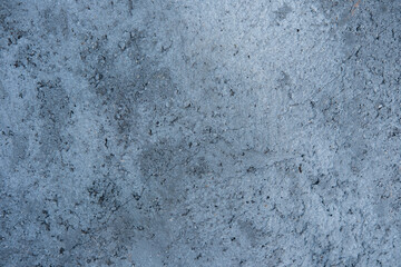 Obraz premium Rough concrete wall texture background with subtle cracks and aggregate detail, showing an aged gray surface