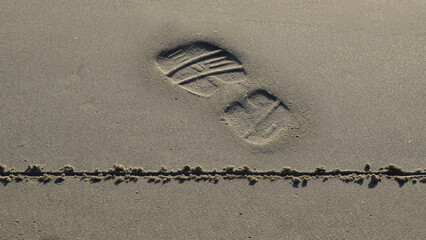 Footprint having crossed over a line in the sand  © T.C.
