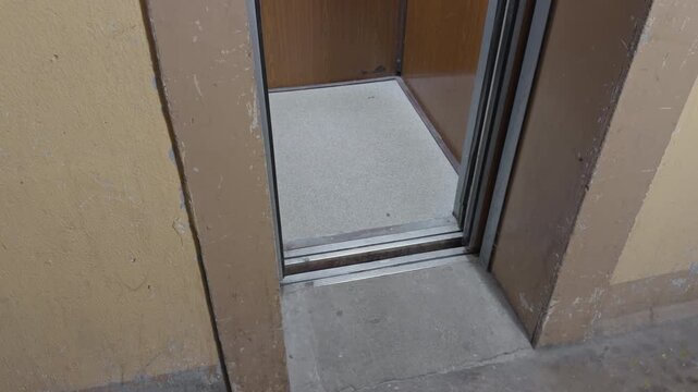 Elevator entrance details. Maintenance inspection of elevator with textured surroundings and safety gap