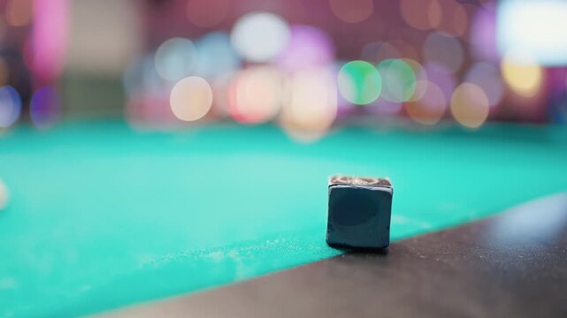 Pool scene imagery. Detailed closeup of pool chalk on felt amidst neon lights and textured surfaces