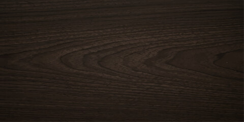 Fototapeta premium A close-up shot showcases the intricate grain patterns of dark wood, highlighting its natural texture and deep, rich color.