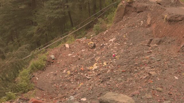 Landslide in mountains destroying road mud flow disaster aftermath