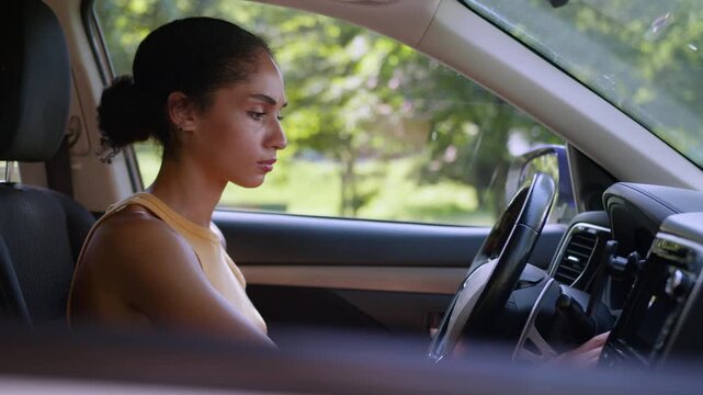 Worried African American woman trying start broken car inside stressed female driver facing battery problem vehicle not working businesswoman auto rental service trouble breakdown charge issue crisis