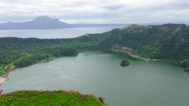 The smallest volcano in the Philippines is Taal with a green crater lake, aerial view. Tagaytay, Philippines. Green lake- Taal Volcano