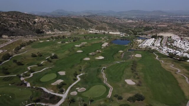 Aerial reveal of the Font del Llop gof course in Monforte del Cid, Spain.