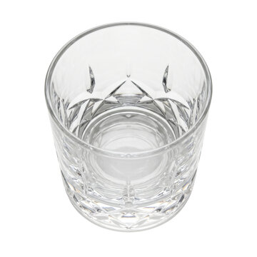 Empty crystal whiskey glass from top view isolated on black