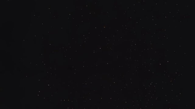 Twinkling Stars Shimmering in Night Sky with Dark Horizon Silhouette