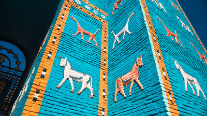 Exploring the vibrant colors of ancient Babylons decorated walls in Iraq © Dave