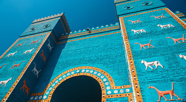 Explore the vibrant Ishtar Gate in Babylon, Iraq with its stunning blue and animal motifs