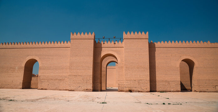 Exploring the ancient walls of Babylon in Iraq under clear blue sky
