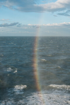 Verical rainbow above the sea