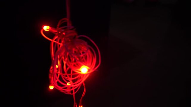 Coiled red LED string light, commonly called fairy or rice light, offering decorative illumination for festivals, celebrations, home d&eacute;cor, parties, and events.