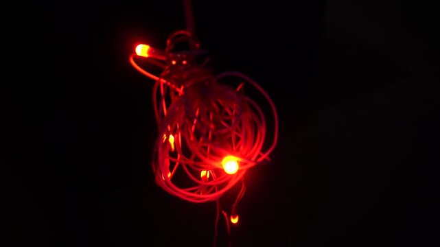Coiled red LED string light, commonly called fairy or rice light, offering decorative illumination for festivals, celebrations, home d&eacute;cor, parties, and events.