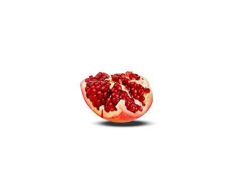 Pomegranate or Punica granatum fruit slice isolated on a white background