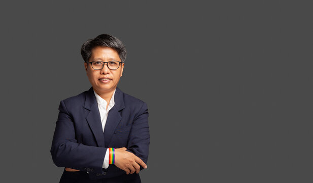 Professional businesswoman with crossed arms in studio