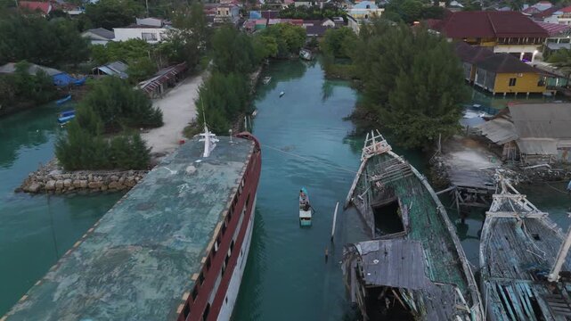 Stilted homes of the Bajau Laut rise gently above turquoise waters, where sea nomads have lived in harmony with the ocean for generations