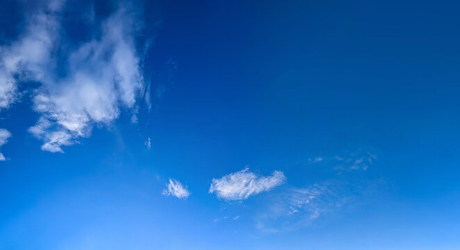 Some cumulus clouds on the blue sky. Cotton cumulus steam volume structure isolated on skyscape backdrop.