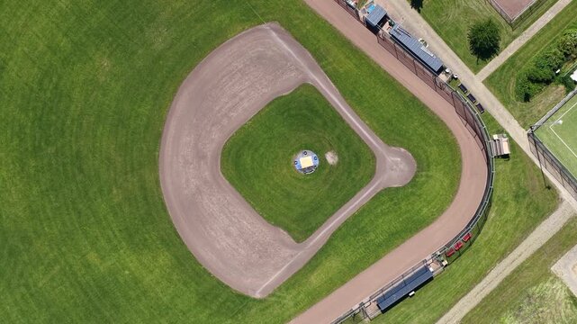 Aerial top down view rotating over empty baseball field