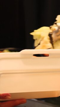 Takeaway street food packed in plastic container ready for office meal