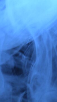 Blue Smoke in Dark Environment Vertical View