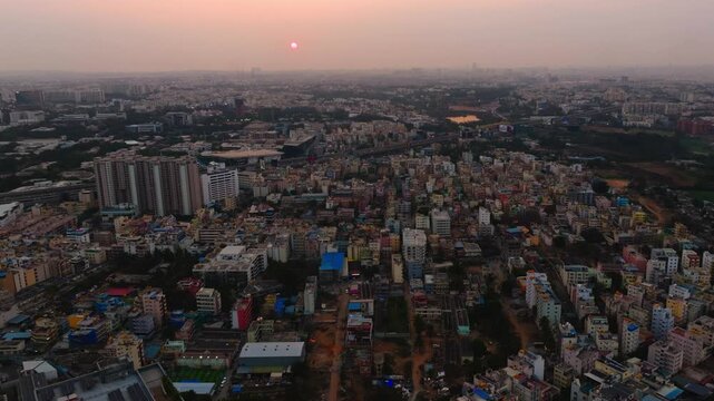 residential buildings with Kolte Patil iTowers Exente apartments and Infosys at electronic city, Bengaluru, karnataka, india. sun set time, push in shot, drone shot, 4k.