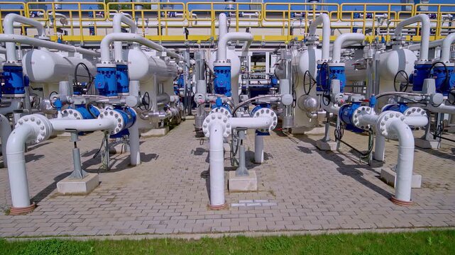 Industrial gas pipelines and valves at a natural gas storage and transport facility
