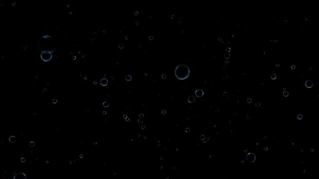 Calm Underwater Environment Showcases Tiny Shimmering Spheres Floating Through Deep Darkness With Slow Grace