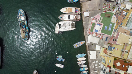 Drone view of Procida marina and coastal waterfront with anchored boats © jovannig
