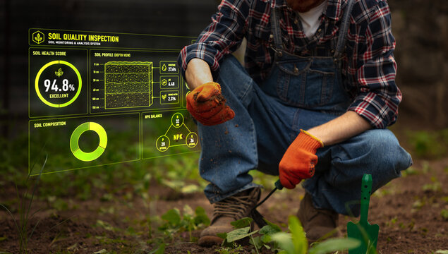Smart soil quality inspection with farmer holding sample in garden. Concept of agritech, soil testing, precision farming, crop planning, sustainability, and smart agriculture.