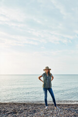 Woman, portrait and space by lake for travel, blue sky or vacation with tourism or fresh air. Female person, traveller or relax by water for lakeside holiday, adventure or calm scenery in Ireland