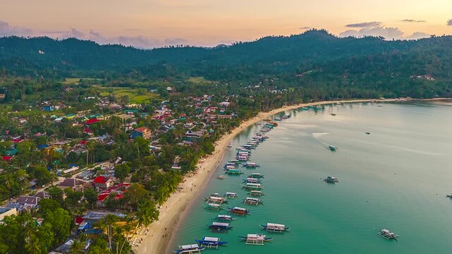 Traditional Wooden Boats Along The Coastal Area Of Padre Burgos Port In Limasawa Island, Southern Leyte, Philippines. Aerial Hyperlapse
