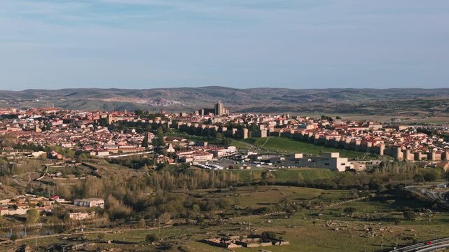 Scenic aerial view of the historic walled city of Avila, Spain, highlighting its medieval architecture and landscape