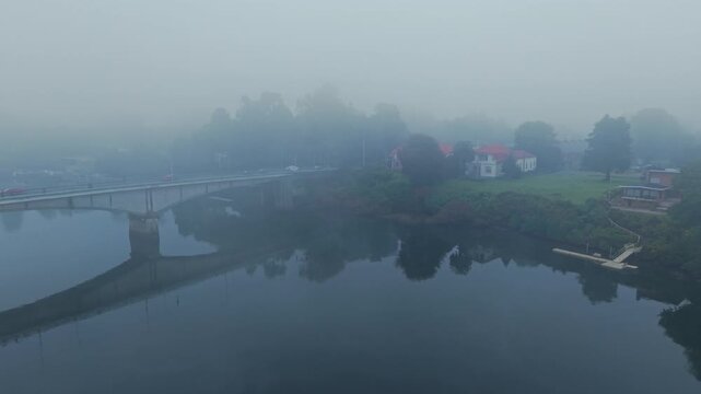 Aerial Dolly In Establish Of River Bank And Teja Island Architecture In Heavy Fog Valdivia Chile