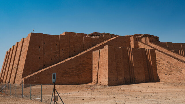 Exploring the ancient ziggurat of Ur in Iraq surrounded by clear blue skies