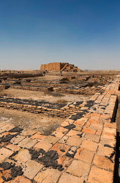 Exploring the ancient ziggurat of ur in iraq under a clear blue sky