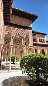 Intricate Moorish decorations cover the walls and ceilings of the Alhambra Palace, Granada, Andalusia, Spain. Vertical view.